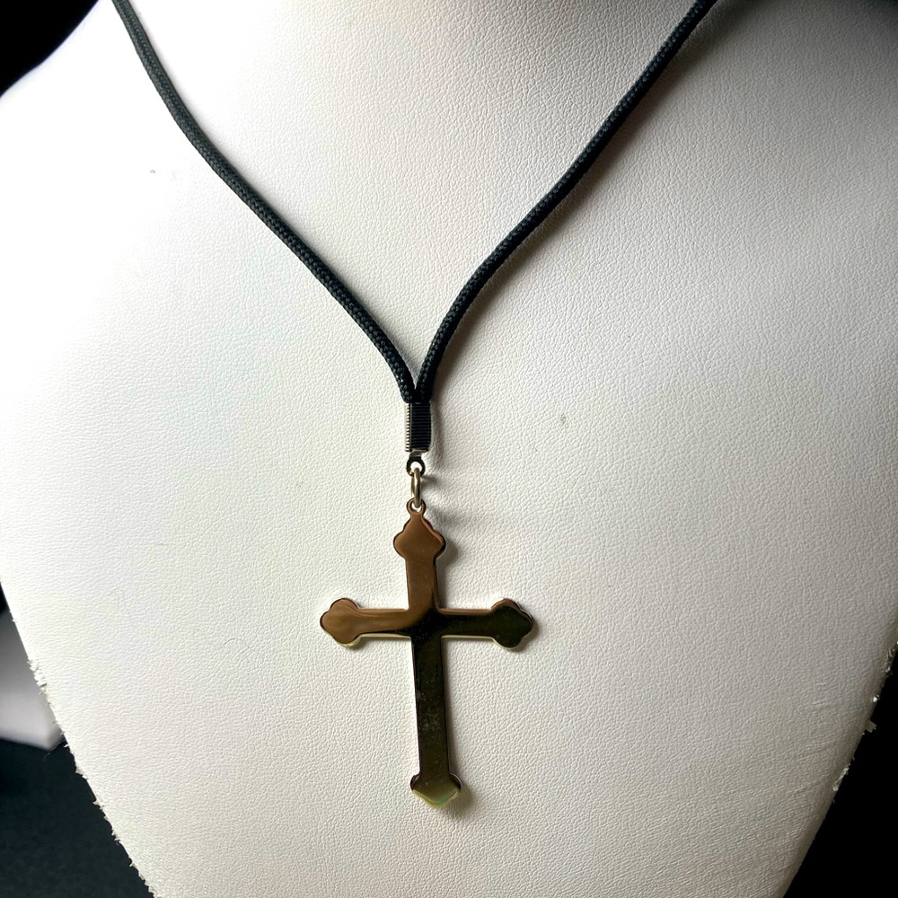 Silver cross on a black twine necklace. #1139